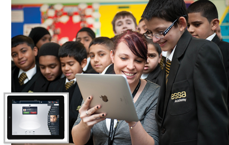 ESSA teacher showing a tablet to students