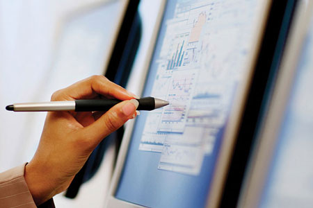 Person using a Pen Stylus to interact with a monitor